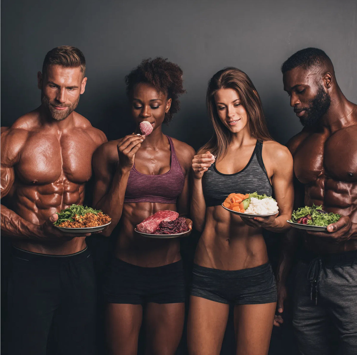 Four athletes holding portion-controlled high-protein meals